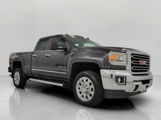2015 GMC Sierra 2500 HD 4WD Double Cab 144.2 SLT in Onyx Black — front three-quarter view