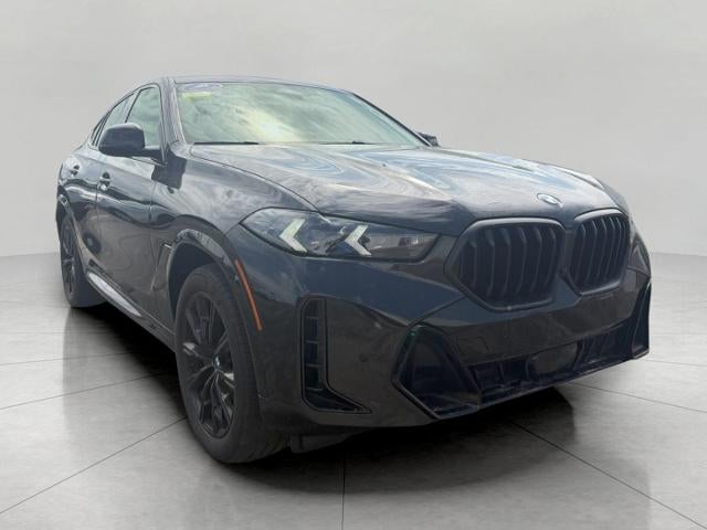 2024 BMW X6 xDrive40i Sports Activity Coupe in Black Sapphire Metallic — front three-quarter view